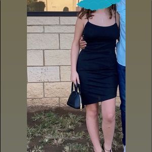 Semi formal asymmetrical sparkly black dress.